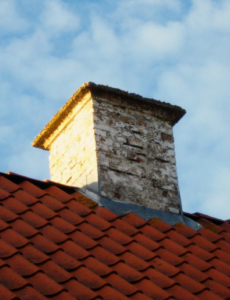 white chimney on red roof