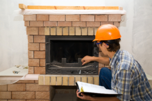 an inspector performing a fireplace inspection